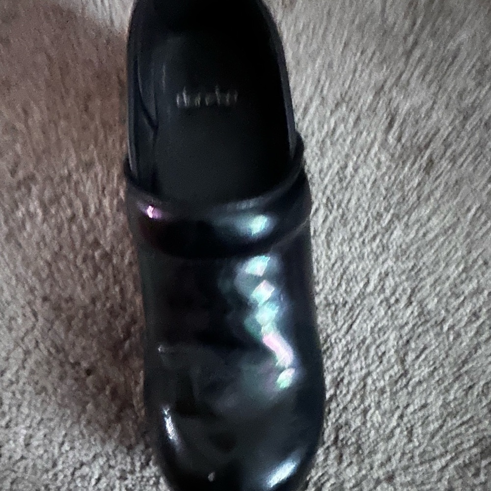 Dansko size 8 Shiny black mirror in color